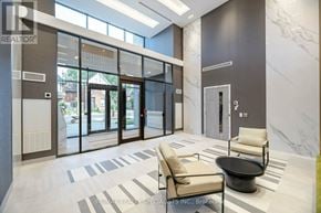 Hamilton (Kirkendall) condo for rent - A lobby with a black table and two chairs.