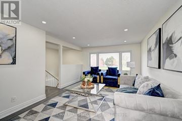 Kitchener apartment for rent - A living room with a white couch and a coffee table.