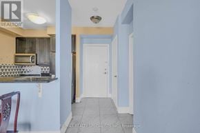 Toronto (West Humber-Clairville) condo for rent - A room with a white door and a blue wall.