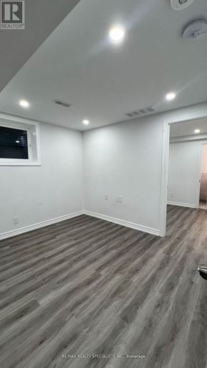 New Tecumseth (Tottenham) apartment for rent - A room with a grey floor and white walls.