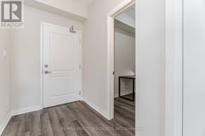 Milton (Wi Willmott) condo for rent - A white door with a number 4 on it is in a room with wooden flooring.