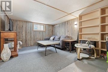 Centre Wellington (Fergus) apartment for rent - A living room with a grey sofa and a wooden table.