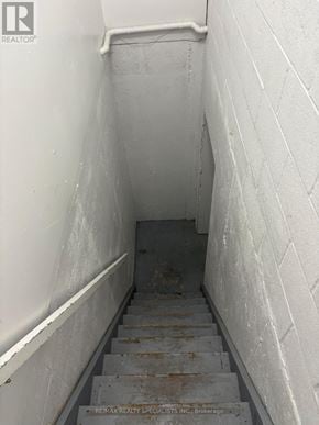 Mississauga (Meadowvale) apartment for rent - A stairway with a white wall and a white railing.