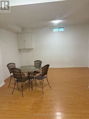 Mississauga (Meadowvale) apartment for rent - A dining room with a glass table and chairs.