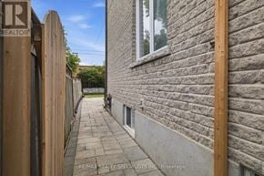 Mississauga (Lakeview) apartment for rent - A narrow alley with a RE/MAX REALTOR sign on the left.