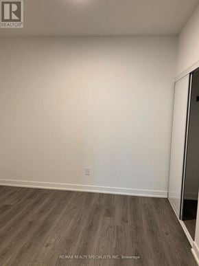 Brampton (Fletcher's Creek South) condo for rent - A room with a wooden floor and a white wall.