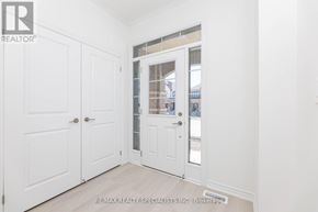 Milton (Walker) apartment for rent - A white door with a glass window is in the middle of a room.