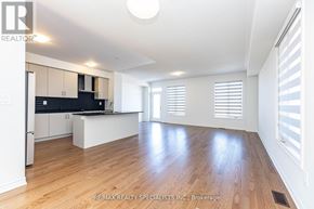 Milton (Walker) apartment for rent - A spacious kitchen with wooden flooring and white walls.