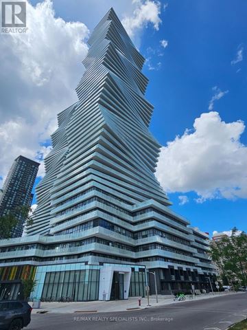 Mississauga (City Centre) condo for rent - A tall, modern building with a unique design stands out against the sky.