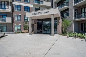 Milton (Fo Ford) condo for rent - The entrance to a building named Leger Way with a glass door and a bench in front.