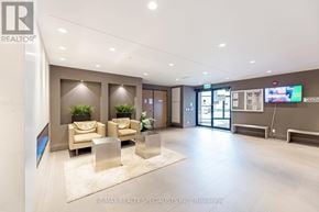 Milton (Fo Ford) condo for rent - A modern office lobby with a reception desk and seating area.