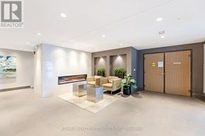 Milton (Fo Ford) condo for rent - A modern office space with a fireplace and seating area.