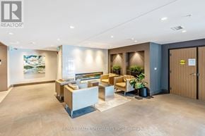 Milton (Fo Ford) condo for rent - A modern office space with a reception desk and seating area.