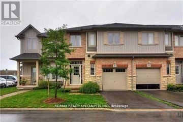 Grimsby (Grimsby Beach) townhouse for rent - A house with a sign that says RE/MAX REALTY SPECIALISTS INC. Brokerage.