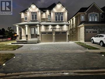 Brampton (Credit Valley) apartment for rent - A large, well-lit house with a car parked in front.