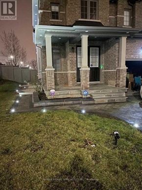 Brampton (Credit Valley) apartment for rent - A house with a porch and a sign that says REALTOR.