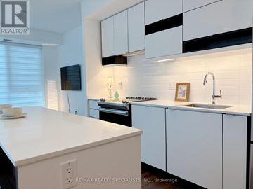 Mississauga (City Centre) condo for rent - A modern kitchen with white cabinets and a white countertop.