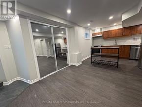 Mississauga (Meadowvale Village) apartment for rent - A kitchen with a refrigerator, oven, and sink.