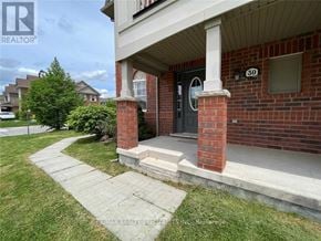 Milton (Ha Harrison) townhouse for rent - A brick house with a black door and a small porch.