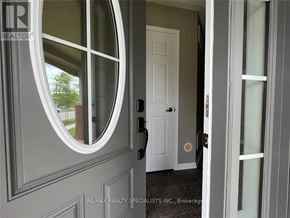 Milton (Ha Harrison) townhouse for rent - A white door with a round window above it.