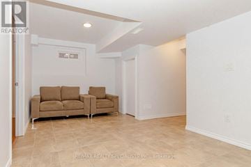 Brampton (Northwest Brampton) apartment for rent - A living room with a couch and a chair.