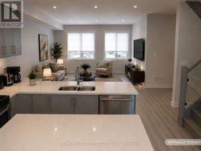 Mississauga (Lakeview) townhouse for rent - A modern kitchen with a dining area and a living room.