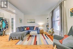 Burlington (Brant) apartment for rent - A living room with a grey couch and a striped rug.