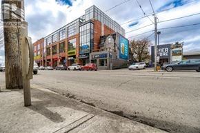 Toronto (Trinity-Bellwoods) apartment for rent - A street view with a building that has a sign that says "BEER".