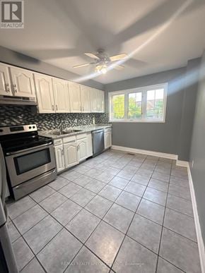 Brampton (Fletcher's Creek Village) townhouse for rent - A kitchen with white cabinets and a tile floor.