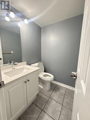 Brampton (Fletcher's Creek Village) townhouse for rent - A bathroom with a toilet, sink, and mirror.