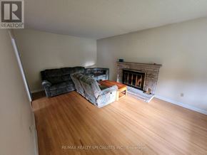 London East (East I) apartment for rent - A living room with a fireplace and a couch.