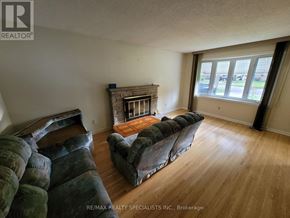 London East (East I) apartment for rent - A living room with a fireplace and a large couch.