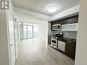Toronto (Little Portugal) condo for rent - A kitchen with white appliances and a white oven.