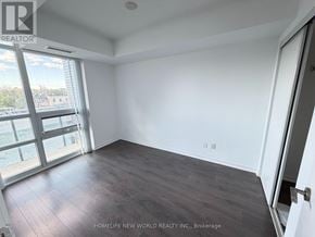 Toronto (Little Portugal) condo for rent - A room with a sliding glass door leading to a balcony.