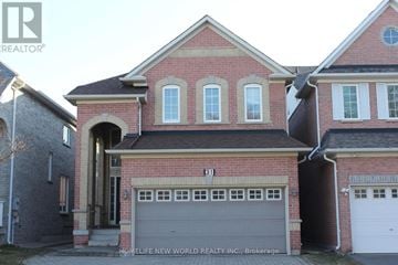 Markham (Berczy) apartment for rent - A two-story brick house with a garage in front.