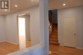 Markham (Berczy) apartment for rent - A room with a staircase and a door.