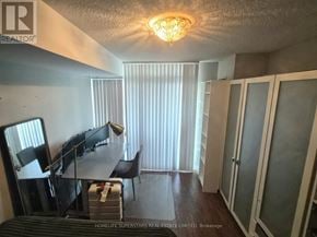 Toronto (Willowdale East) condo for rent - A room with a table, chairs and a bed in it.