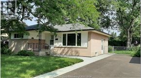 Windsor apartment for rent - A house with a driveway in front of it.