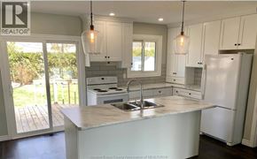Windsor apartment for rent - A kitchen with a sink and a refrigerator.