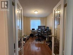 Oshawa (Taunton) apartment for rent - A home office with a desk, chairs, and computer setup.