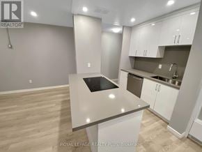 Mississauga (Applewood) condo for rent - A kitchen with white cabinets and a countertop.