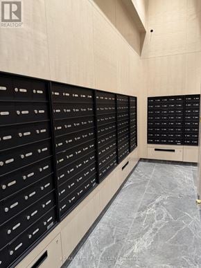 Toronto (Dovercourt-Wallace Emerson-Junction) condo for rent - A row of black mailboxes on a wall.