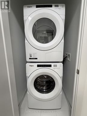 Toronto (Dovercourt-Wallace Emerson-Junction) condo for rent - Two white Whirlpool washing machines in a small laundry room.