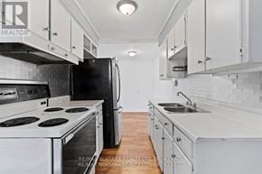 St. Catharines (Port Dalhousie) apartment for rent - A room with a window and wooden flooring.