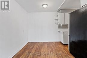 St. Catharines (Port Dalhousie) apartment for rent - A room with a doorway leading to another room.