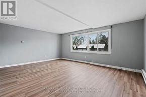 St. Catharines (Port Dalhousie) apartment for rent - A room with a window showing a snowy landscape outside.