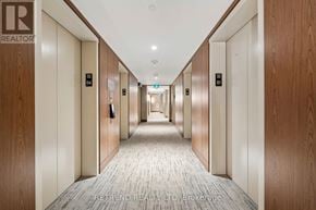 Toronto (Waterfront Communities) condo for rent - A hallway with doors numbered 32 and 33.