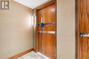 Toronto (Waterfront Communities) condo for rent - A wooden door with a blue ribbon tied around it.