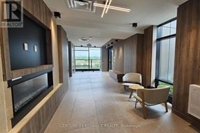 Oakville (Jm Joshua Meadows) condo for rent - A spacious office lobby with a reception desk and comfortable seating.