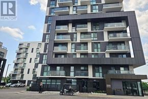 Oakville (Jm Joshua Meadows) condo for rent - A modern apartment building with a black and white facade.